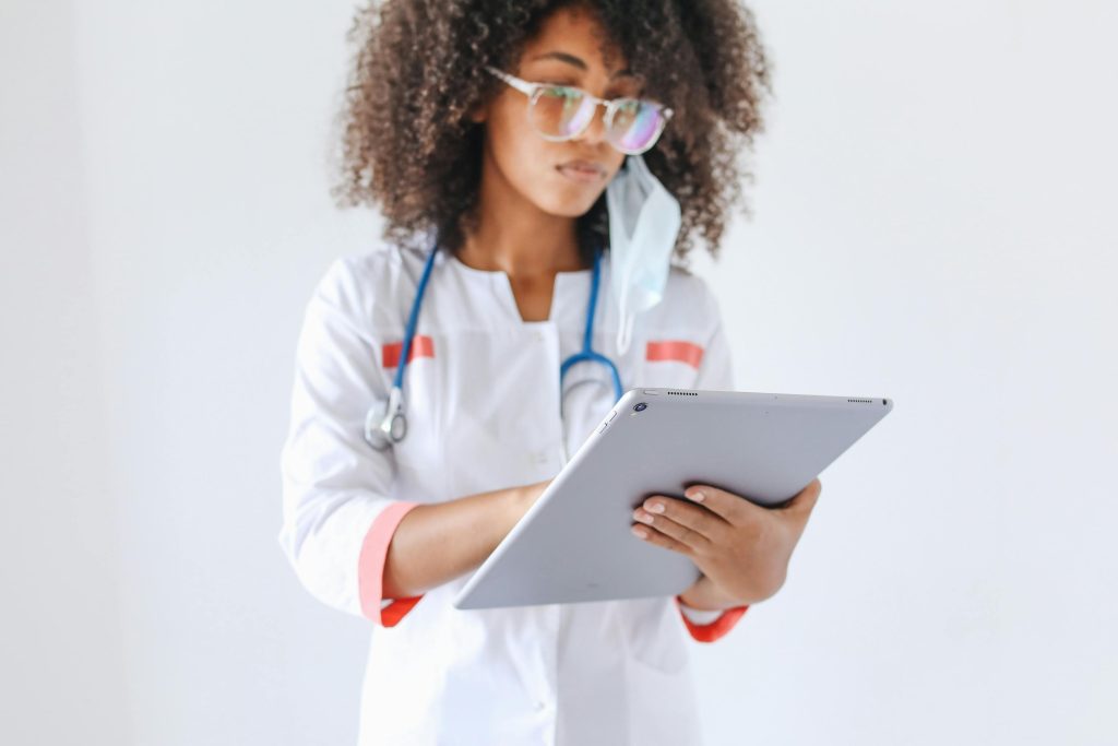 A healthcare professional wearing gloves and preparing a medical sample in a laboratory. The demand for medical and laboratory technologists is rising, making this field one of the 7 fastest-growing careers to watch in 2025 as healthcare innovation expands.